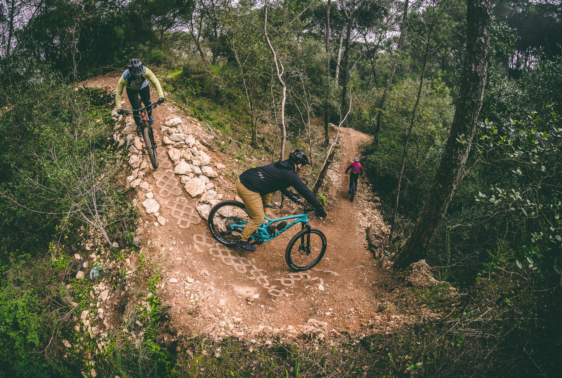 A group of mountain bike riders on a group tour in Monsanto (Portugal)